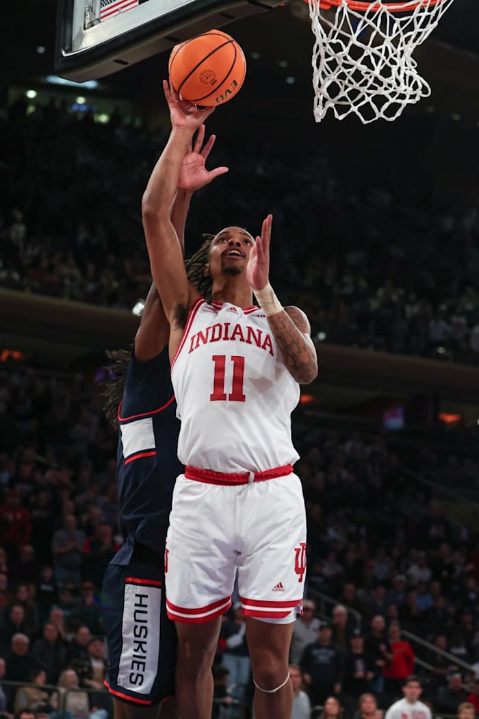 Indiana Hoosiers guard CJ Gunn (11) goes to the basket against Connecticut Huskies guard Tristen Newton (2) during the second half at Madison Square Garden.